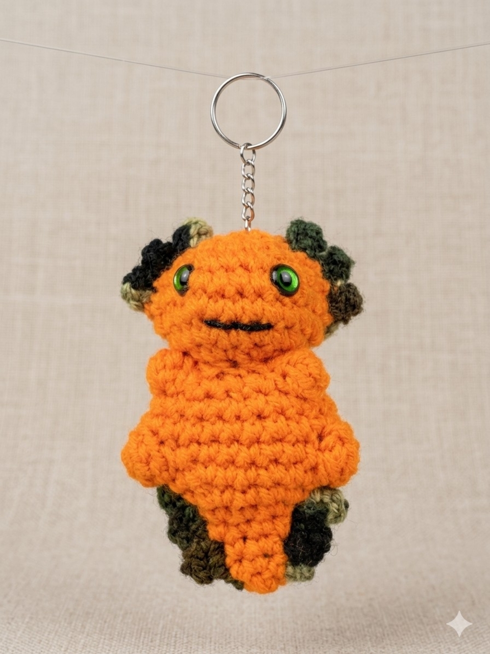 Handmade Orange Crochet Keychain Plush with Green Accents